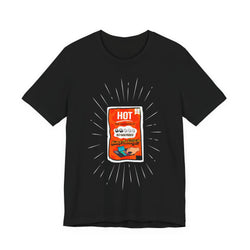 All Black t-shirt with a graphic of a hot sauce packet on a white background