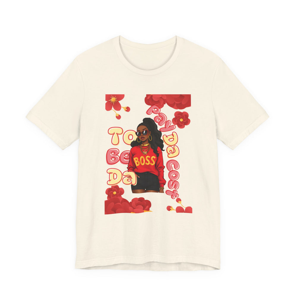 Beige t-shirt with graphic design featuring a person in a red outfit and text on a white background