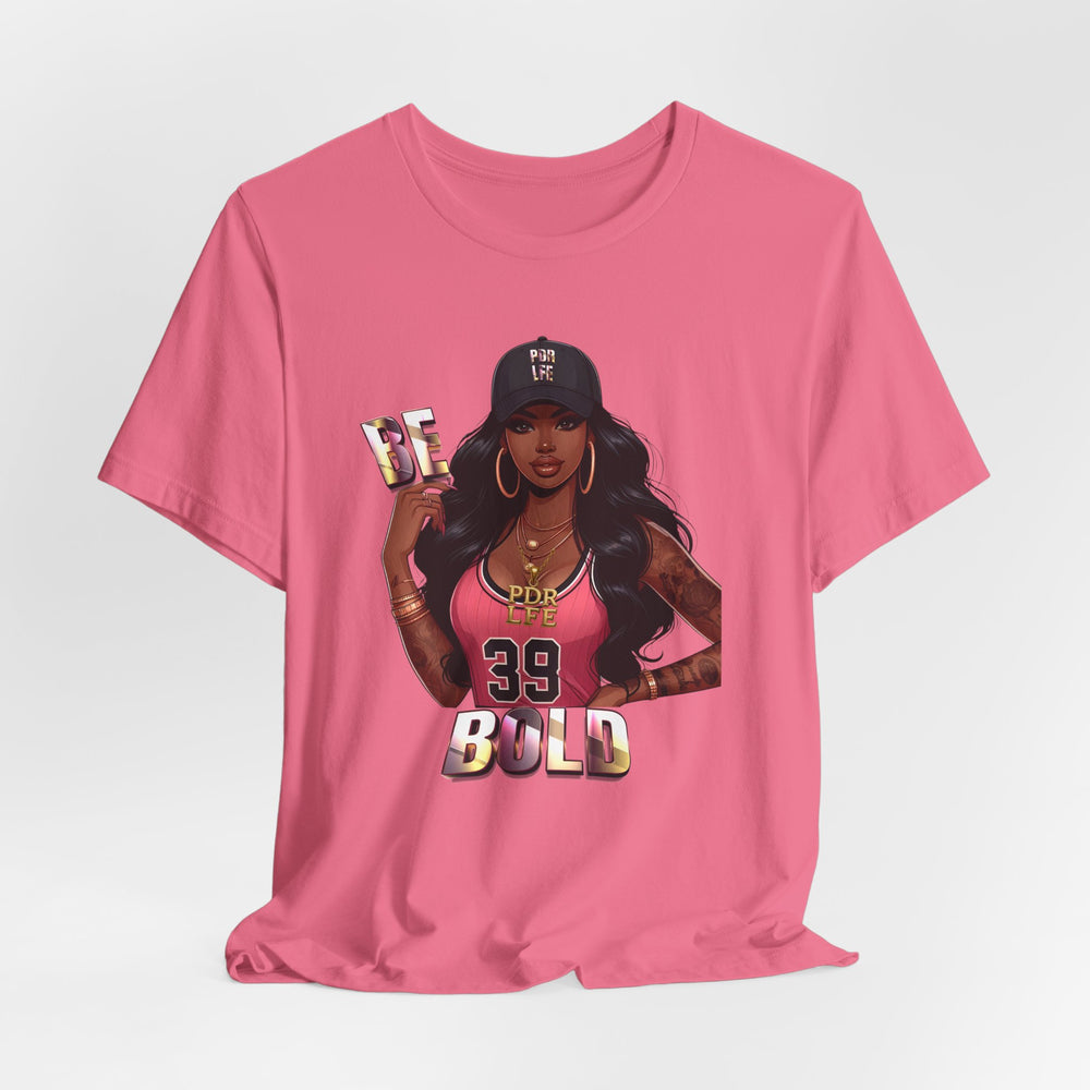 Charity Pink t-shirt with a graphic of a woman and text 'BE BOLD' on a white background