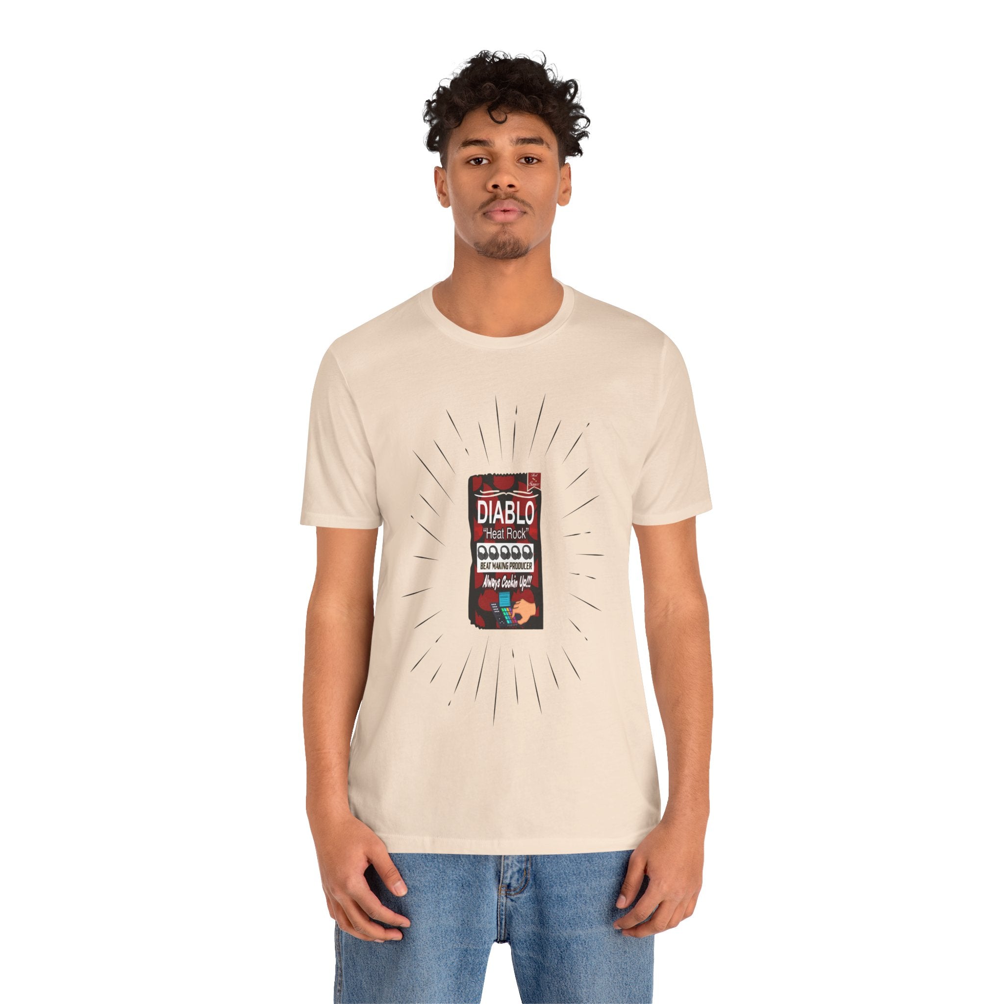Man wearing a beige t-shirt with a graphic design on a white background