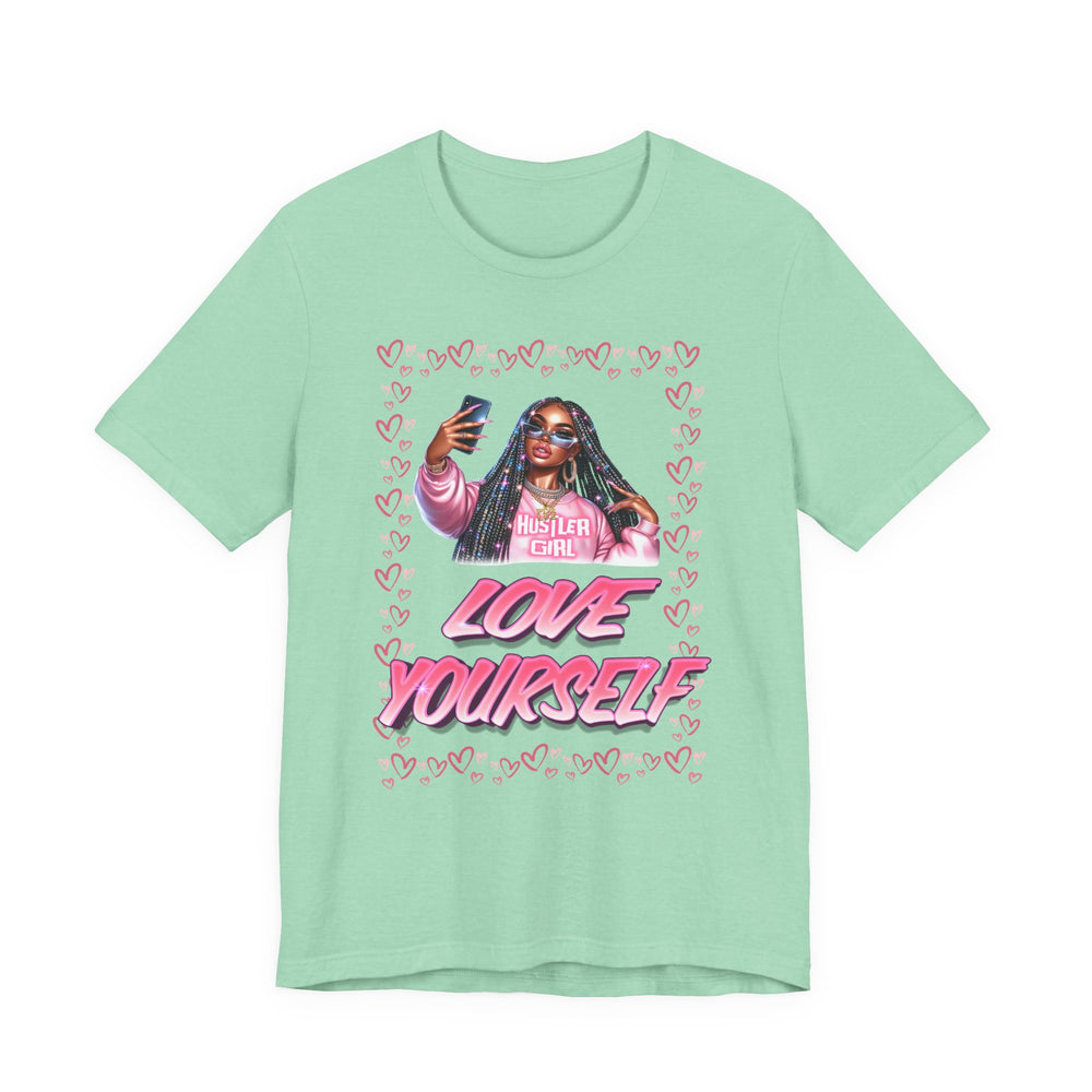 Mint green t-shirt with graphic design of a person holding a phone and text 'LOVE YOURSELF' on a white background.