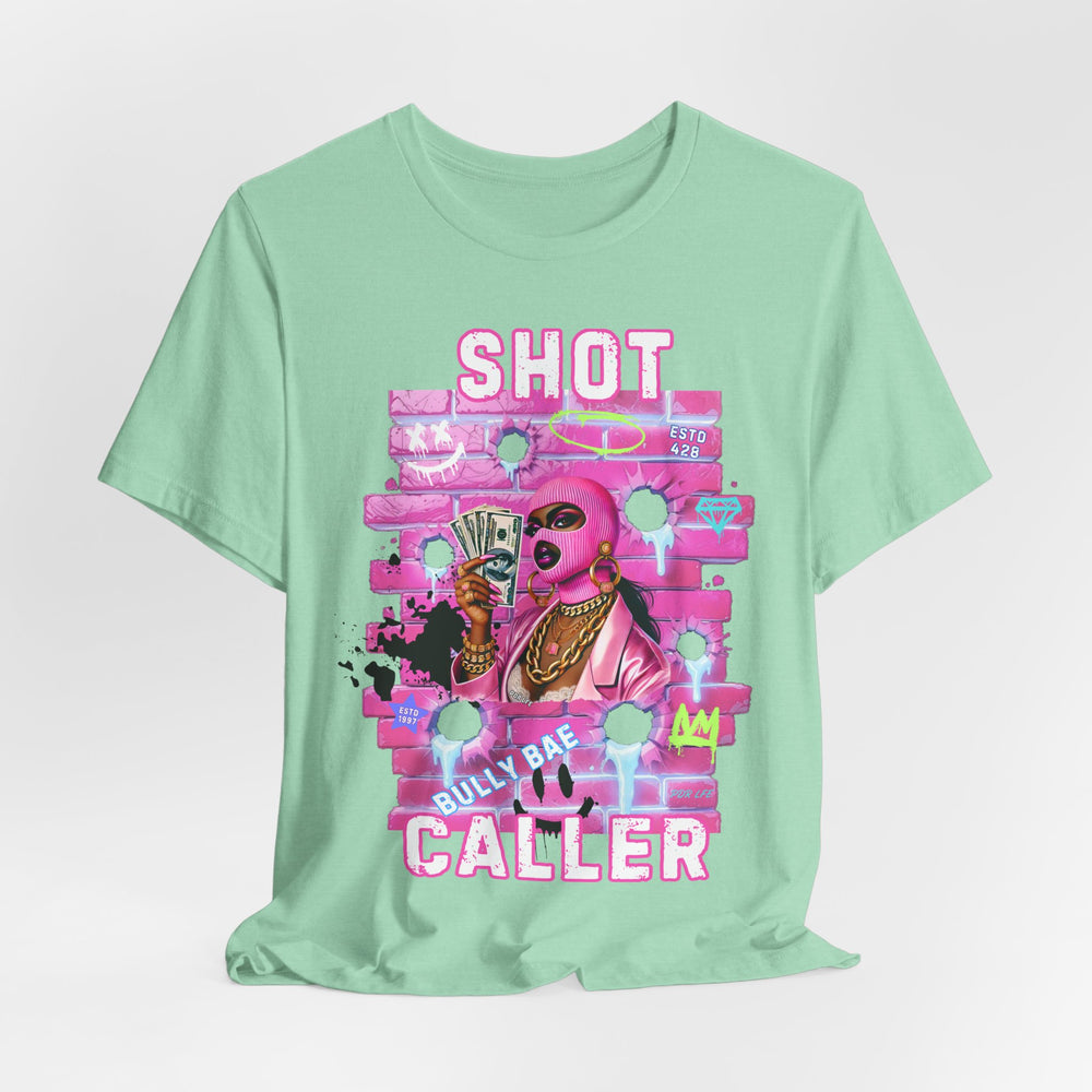 Mint green t-shirt with pink graphic design on a light gray background