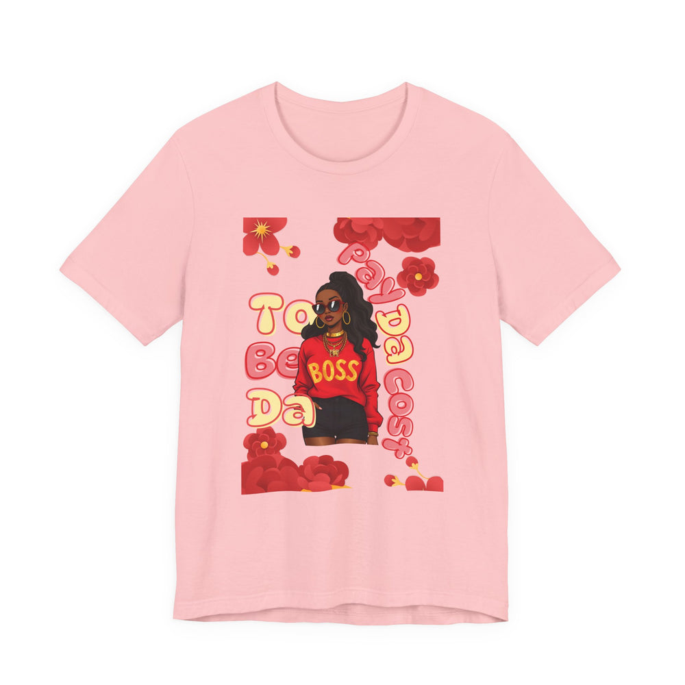 Pink t-shirt with a graphic of a person in a red outfit and text on a white background