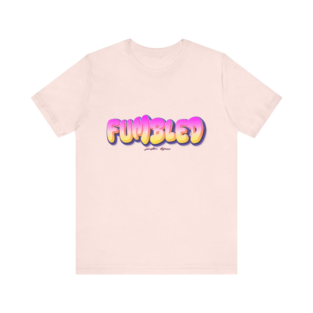 Pink t-shirt with colorful 'FUMBLED' text on a white background