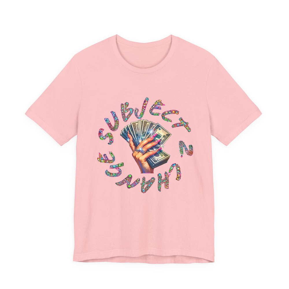 Pink t-shirt with colorful text and hand holding money graphic on a white background