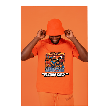 Man wearing a SKELZIES orange t-shirt with a graphic design and text, against an orange background