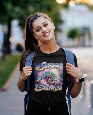 Woman wearing SUBJECT 2 CHANGE FULL MOON black t-shirt with a colorful graphic design outdoors.