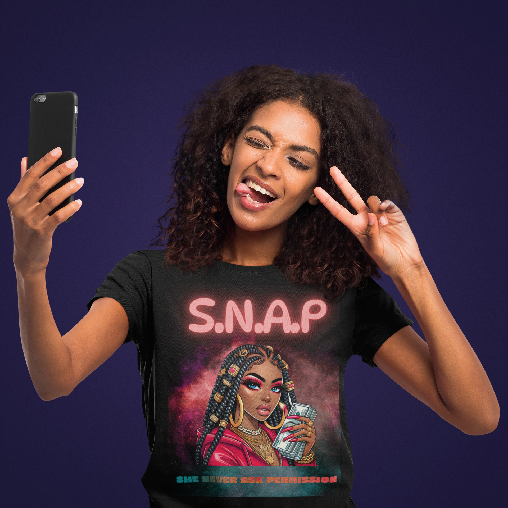 Woman wearing a t-shirt with a graphic design and text, taking a selfie against a dark background.