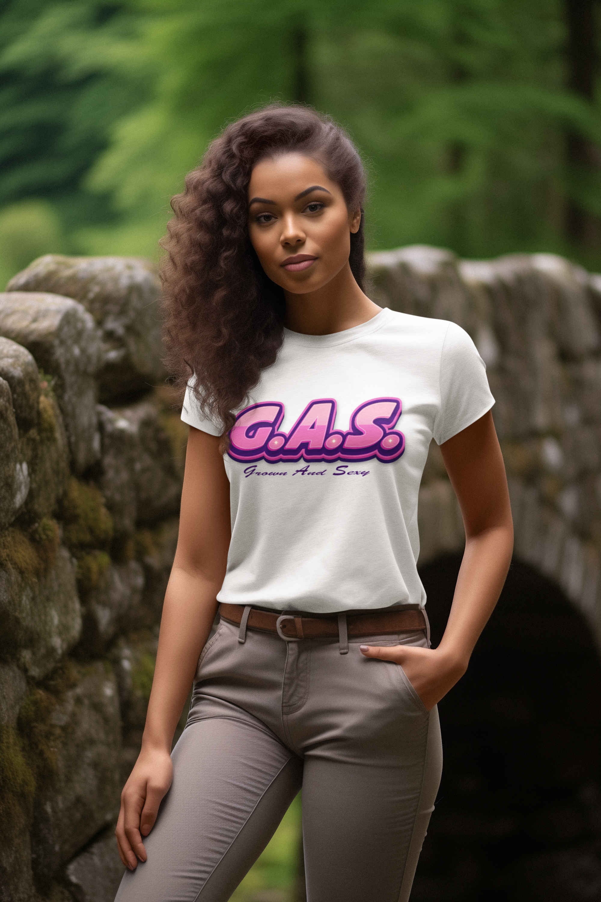 Woman wearing a white t-shirt with 'G.A.S.' text in a forest setting