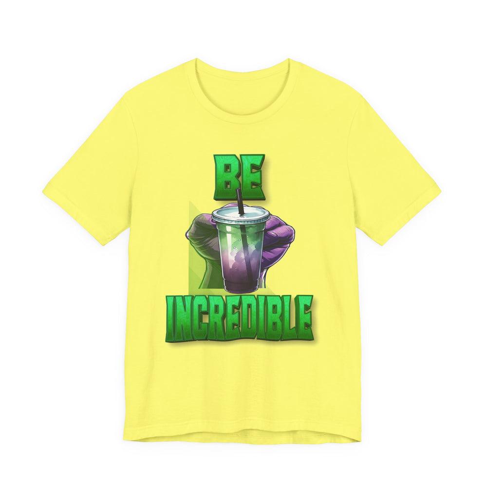 Yellow t-shirt with a graphic of a green drink and text 'BE INCREDIBLE' on a white background